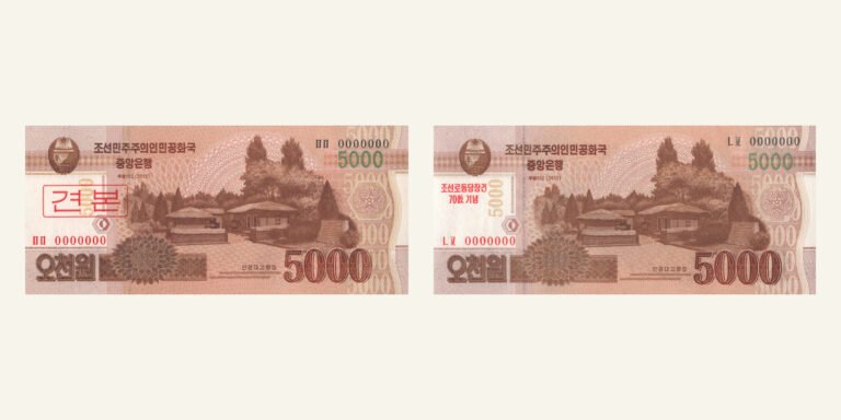 Two North Korean 5,000-won notes with zero serial numbers: a specimen on the left and an anniversary commemorative on the right.